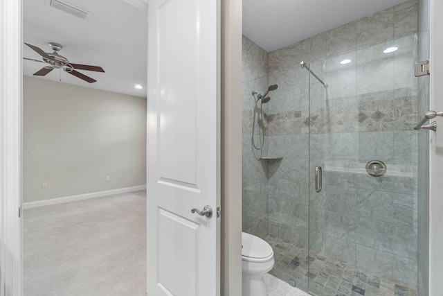 bathroom featuring an enclosed shower, ceiling fan, and toilet