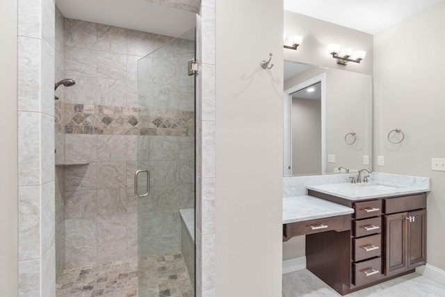 bathroom featuring an enclosed shower and vanity