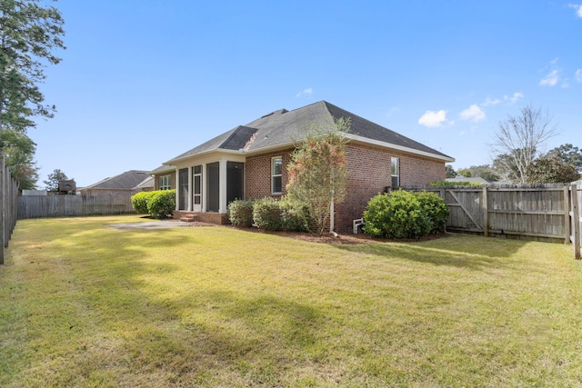 back of house with a yard