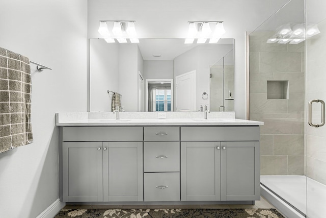 bathroom with vanity and a shower with shower door