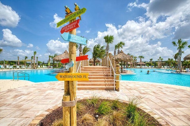 view of swimming pool featuring a gazebo and a patio