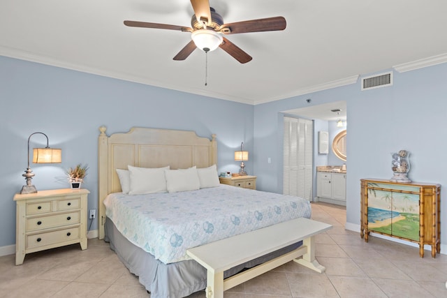 bedroom with ornamental molding, light tile patterned floors, ceiling fan, ensuite bath, and a closet