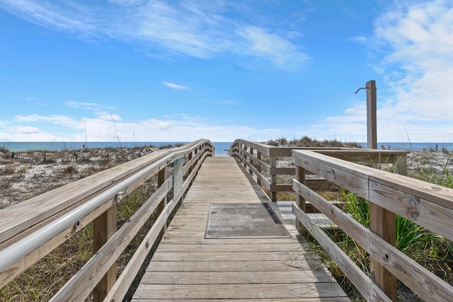 surrounding community featuring a water view