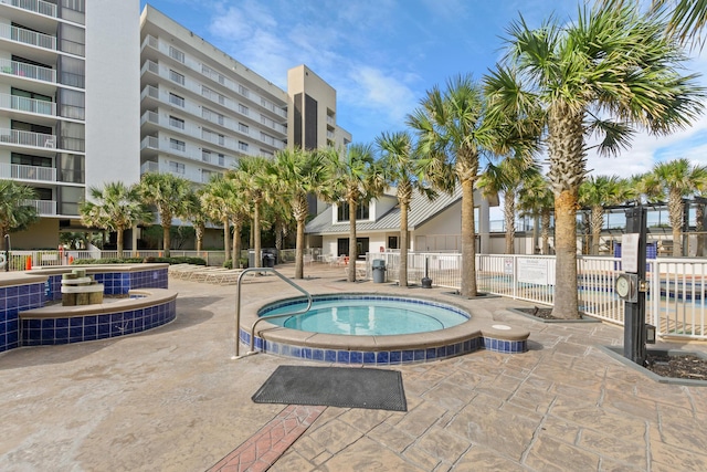 view of pool with a community hot tub