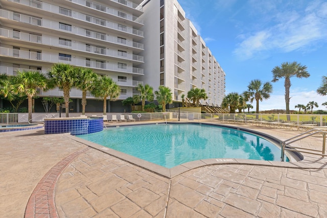 view of swimming pool with a patio