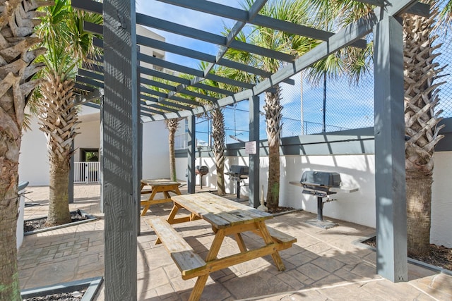 view of patio featuring grilling area and a pergola