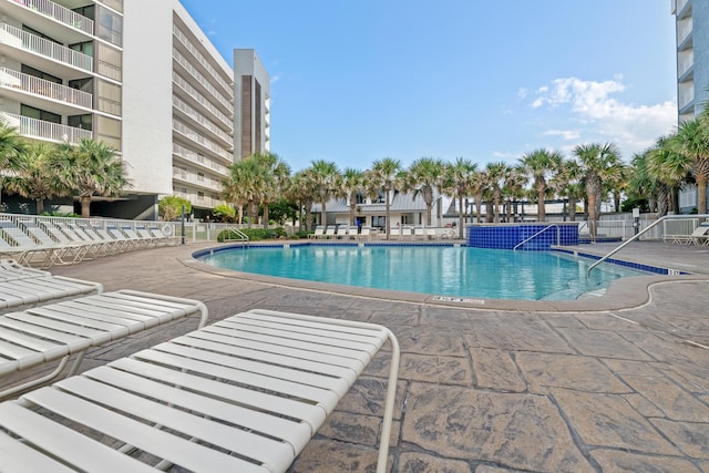 view of swimming pool featuring a patio