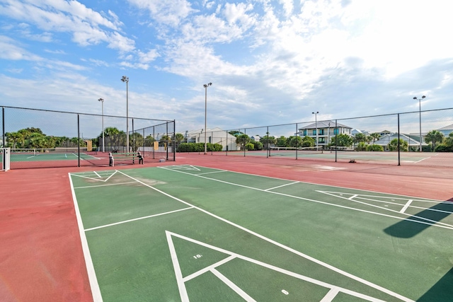 surrounding community featuring tennis court