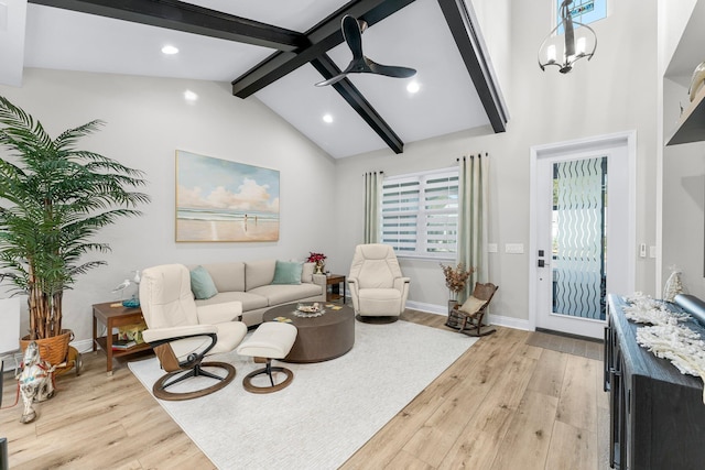 living room with ceiling fan, high vaulted ceiling, beam ceiling, and light hardwood / wood-style floors