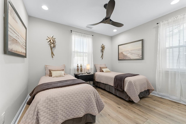 bedroom featuring ceiling fan and light hardwood / wood-style flooring