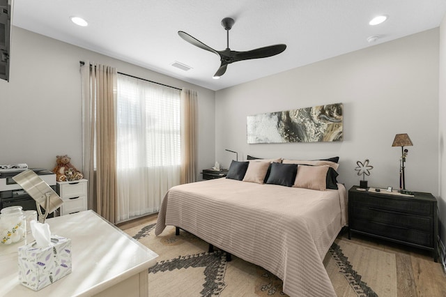 bedroom featuring ceiling fan and light wood-type flooring