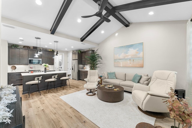 living room featuring light hardwood / wood-style flooring, lofted ceiling with beams, and ceiling fan