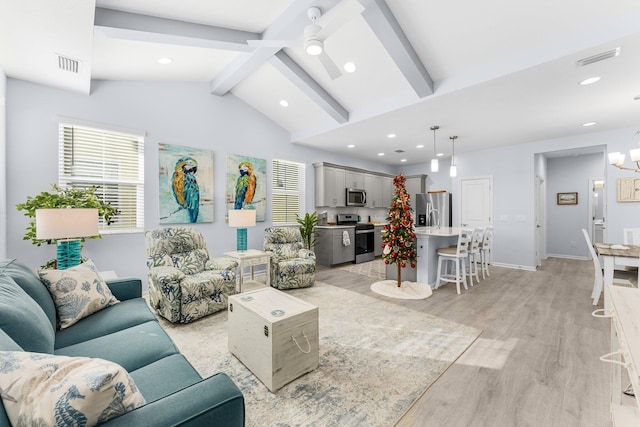 living room with vaulted ceiling with beams, ceiling fan, and light hardwood / wood-style flooring