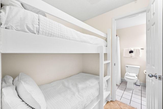 bedroom featuring light tile patterned flooring