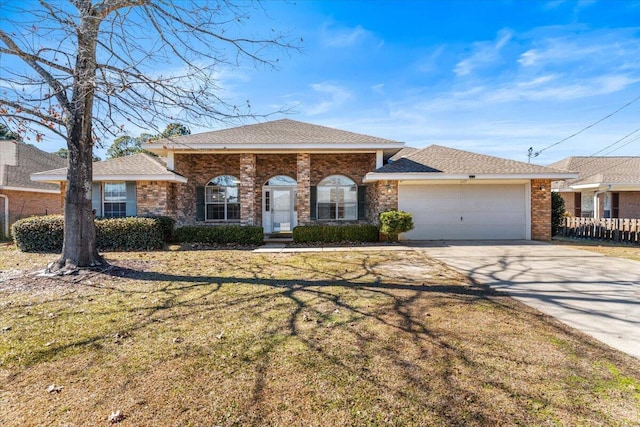 ranch-style house with a garage and a front lawn