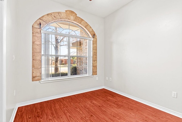 empty room with hardwood / wood-style floors