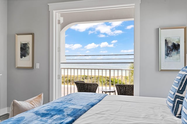 bedroom featuring a water view