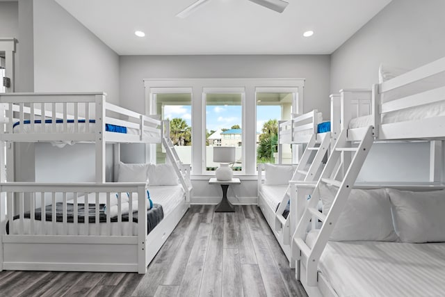 bedroom with hardwood / wood-style floors and ceiling fan