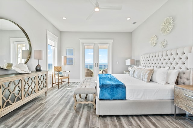 bedroom featuring hardwood / wood-style flooring, access to outside, french doors, and ceiling fan