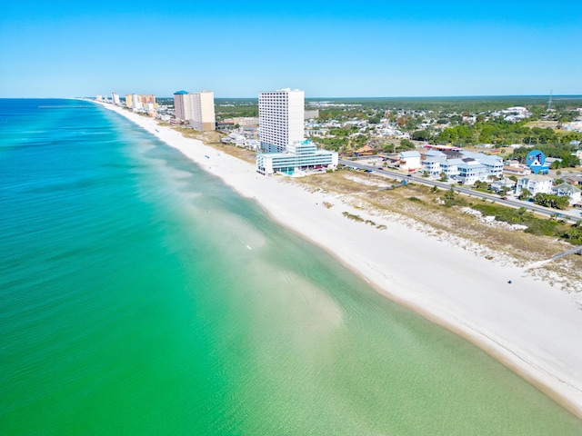 aerial view featuring a water view and a beach view