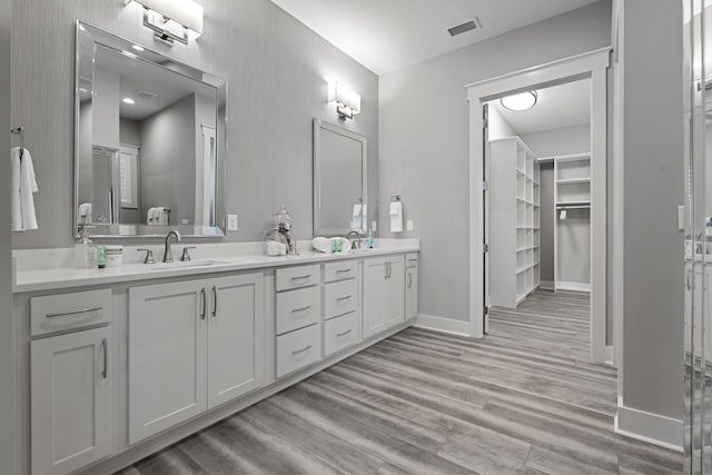 bathroom featuring vanity and wood-type flooring