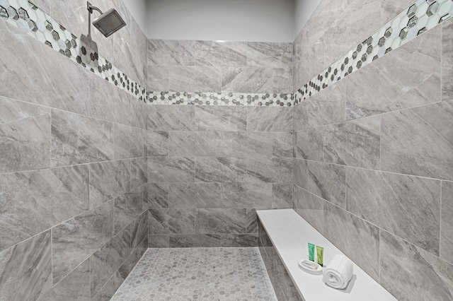 bathroom with a tile shower