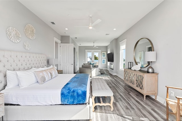 bedroom with hardwood / wood-style floors and ceiling fan