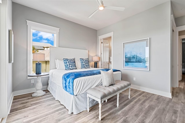 bedroom featuring hardwood / wood-style flooring and ceiling fan