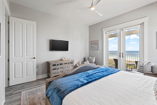 bedroom with wood-type flooring, access to outside, french doors, and ceiling fan