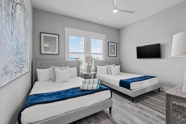 bedroom with wood-type flooring and ceiling fan