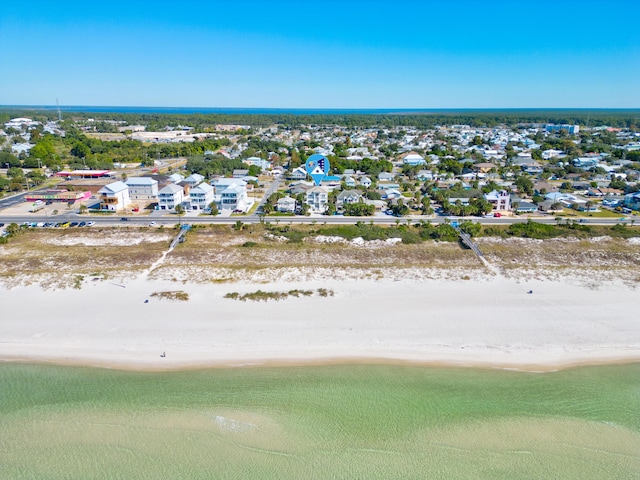 bird's eye view featuring a view of the beach and a water view