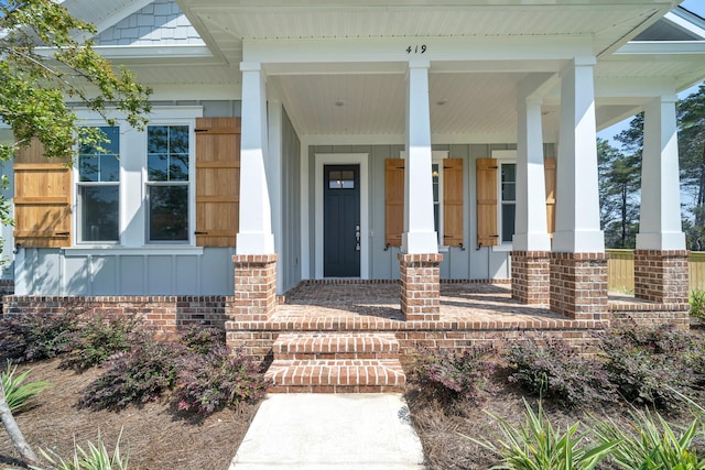 property entrance featuring covered porch