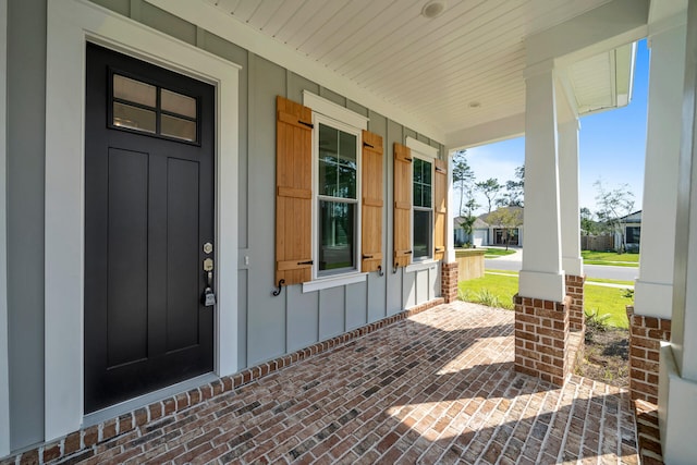 doorway to property with a porch