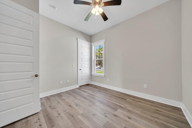 unfurnished room featuring ceiling fan and light wood-type flooring