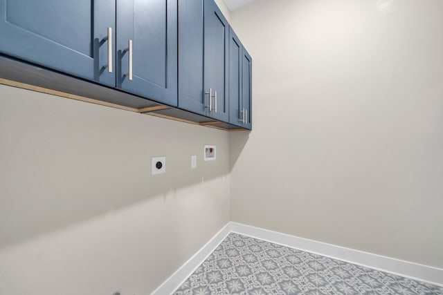 laundry room with hookup for a washing machine, hookup for an electric dryer, cabinet space, and baseboards