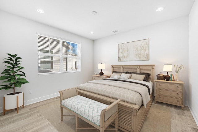 bedroom with light hardwood / wood-style floors