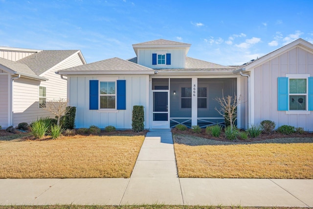 view of front of property with a front lawn