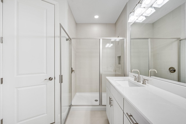 bathroom with vanity and walk in shower