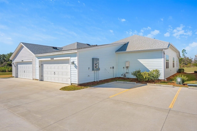 view of side of property with a garage