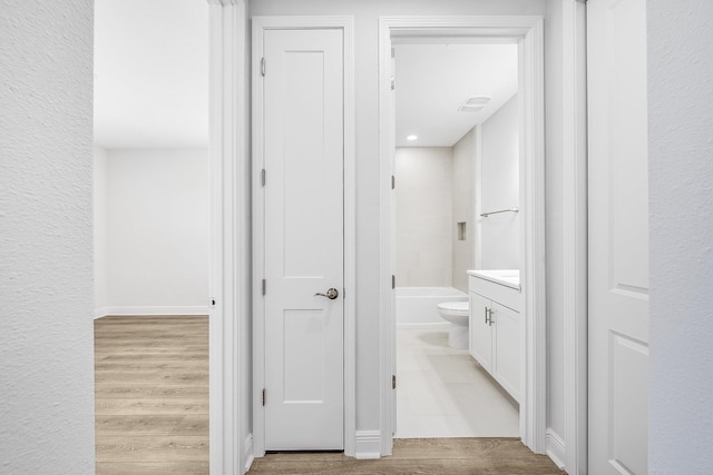 full bathroom featuring vanity, hardwood / wood-style floors, toilet, and shower / bath combination