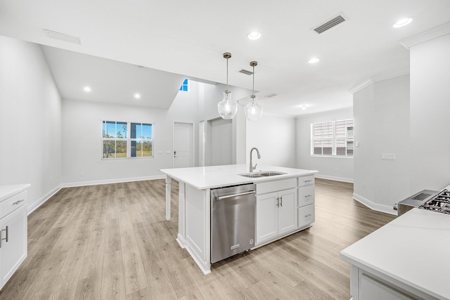 kitchen featuring pendant lighting, white cabinetry, dishwasher, sink, and an island with sink