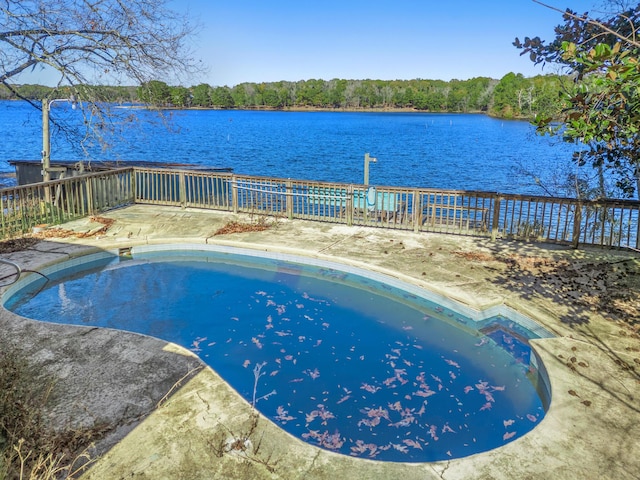 view of swimming pool with a water view