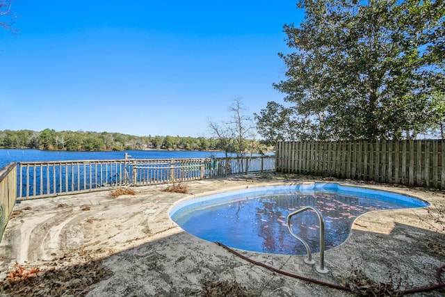 view of pool with a water view