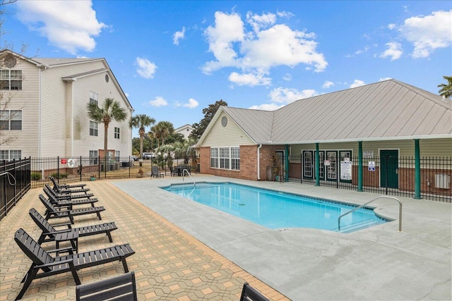 view of swimming pool featuring a patio area