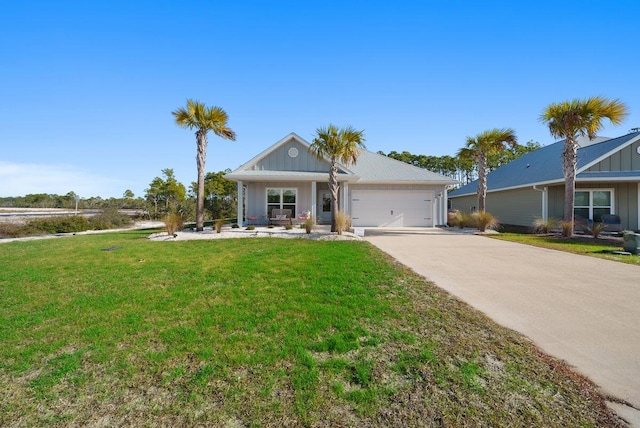 ranch-style home featuring a garage and a front yard