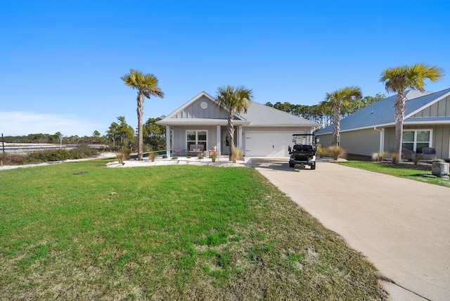 view of front of home with a garage and a front yard