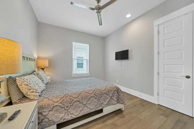 bedroom featuring ceiling fan and light wood-type flooring