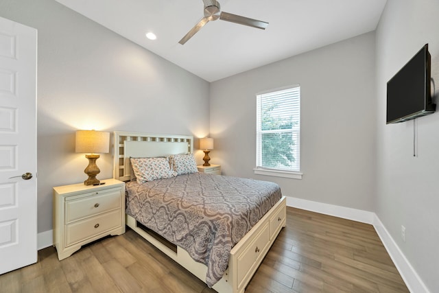 bedroom with ceiling fan and light hardwood / wood-style floors