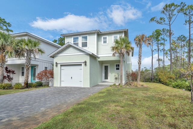 view of front facade featuring a garage and a front lawn