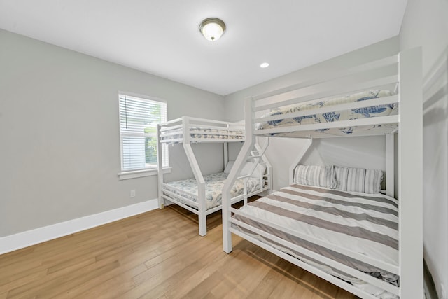 bedroom with hardwood / wood-style flooring